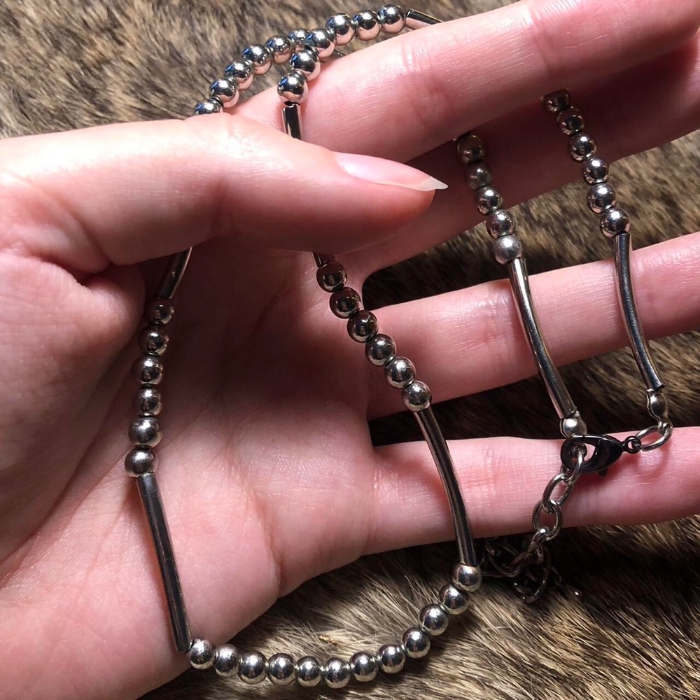 Silver toned bead and barrel necklace